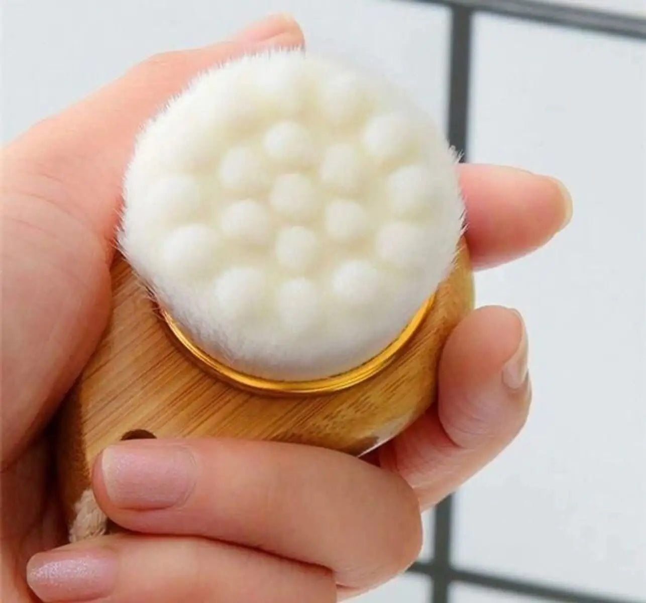 Eco Bath 6-Piece Kit facial brush with durable bamboo handle and soft bristles for gentle cleansing.