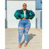 Large Denim Trousers for Women showcased with a stylish green sequined crop jacket in an outdoor setting.