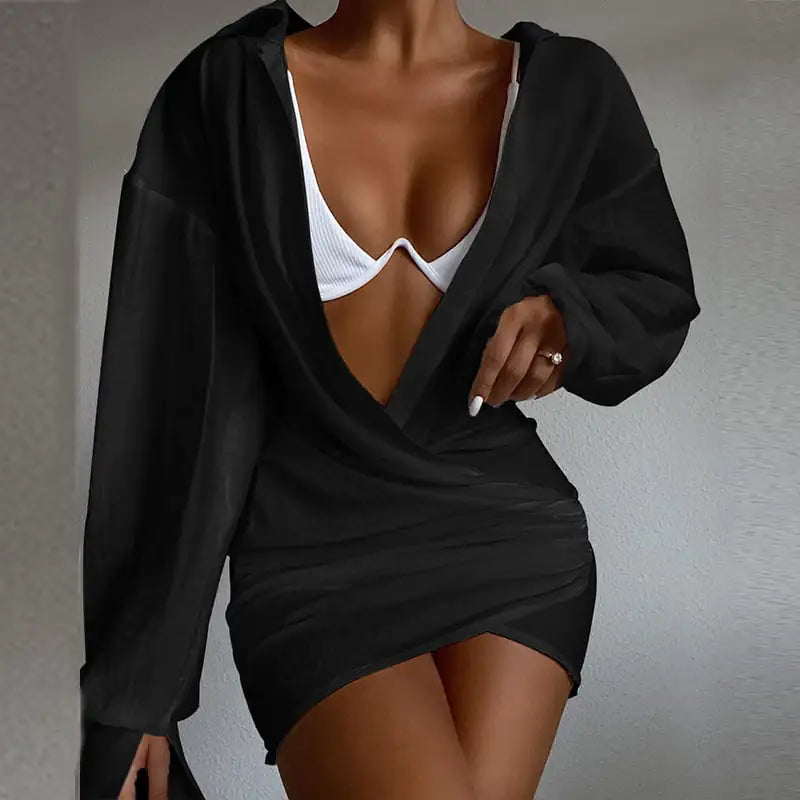 Chic Deep V-Neck Long Sleeve Mini Dress in black featuring a deep neckline and stylish long sleeves.