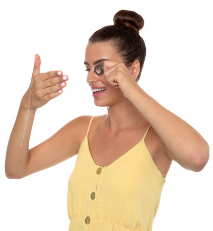 Woman wearing Yogi Serenity Charm necklace, showcasing inner peace and mindfulness with a joyful expression.