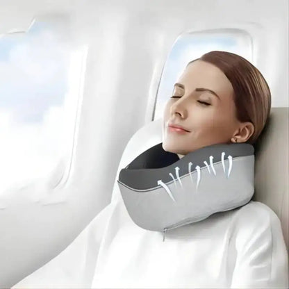 Woman using a travel neck pillow on an airplane seat