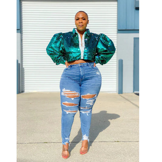 Large Denim Trousers for Women worn with a stylish sequined top in a sunny outdoor setting.