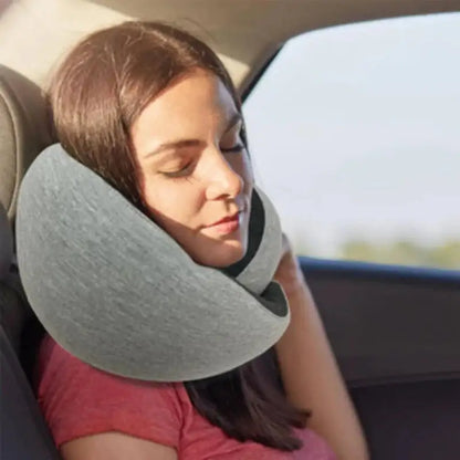 Person using a travel neck pillow in a car