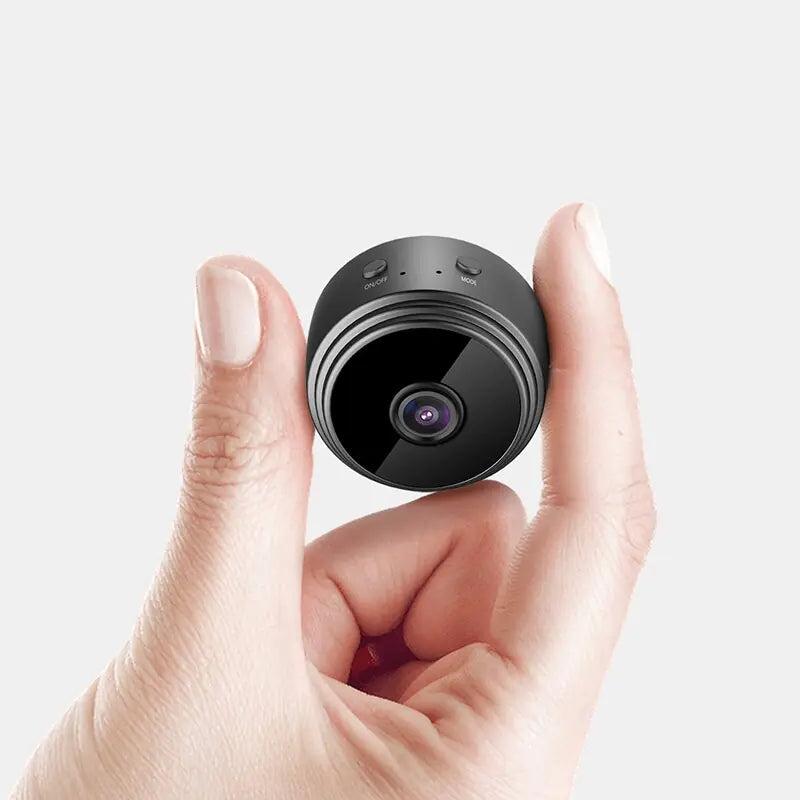 SmartView Mini WiFi Camera held in a hand showcasing its compact design and lens.